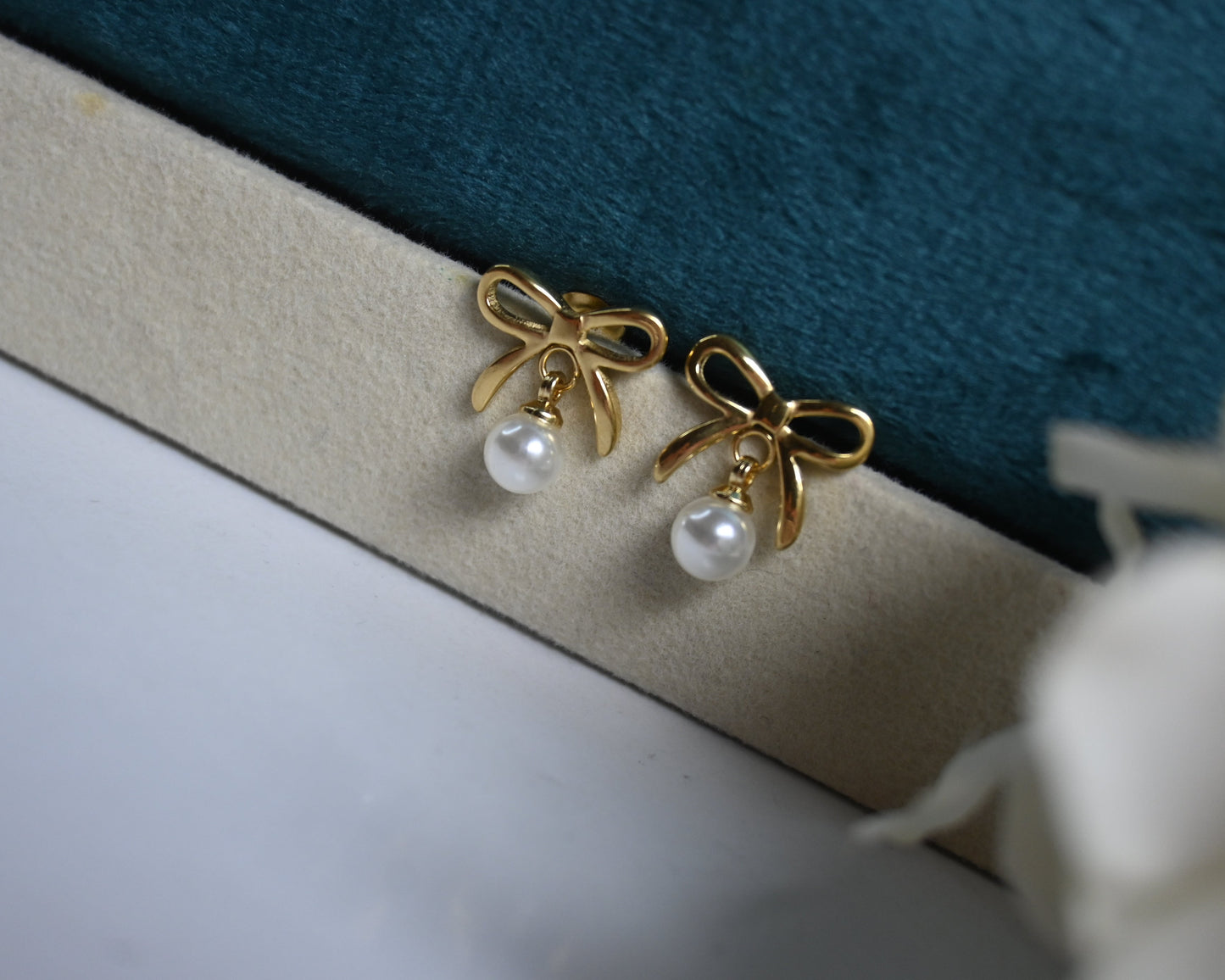 Bow with pearl drop