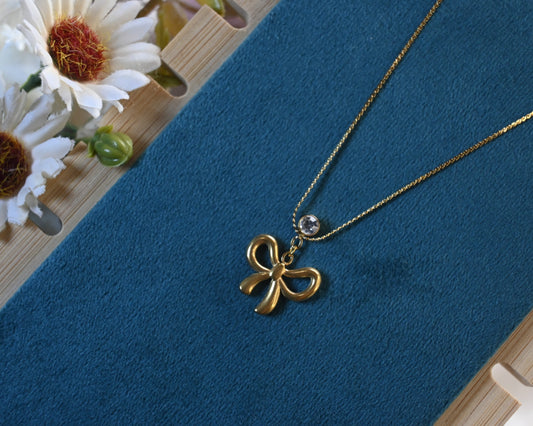 bow with pearl necklace
